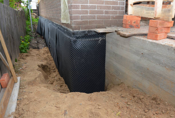 Happy homeowners after waterproofing job in Flat Rock